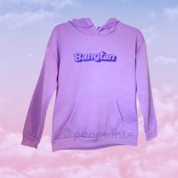 a purple hoodie with the word bangtan on it