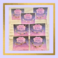 a set of bracelets with the word p a l on them